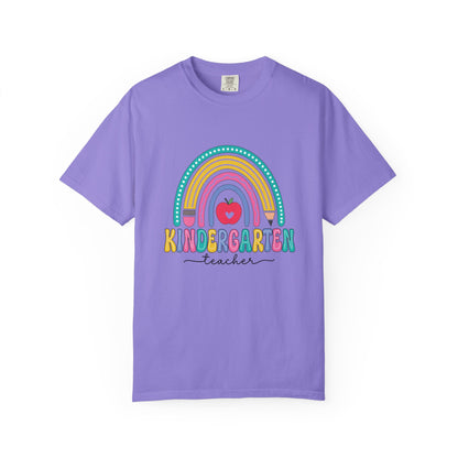 Violet t-shirt with rainbow, pencil and apple design, labeled 'Kindergarten teacher' ideal gift for teacher appreciation