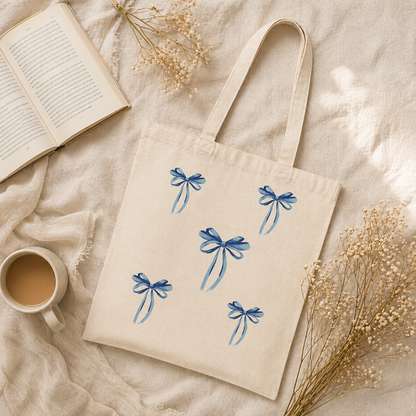 blue ribbon bow canvas tote bag on natural cotton fabric, aesthetic reusable shopping bag
