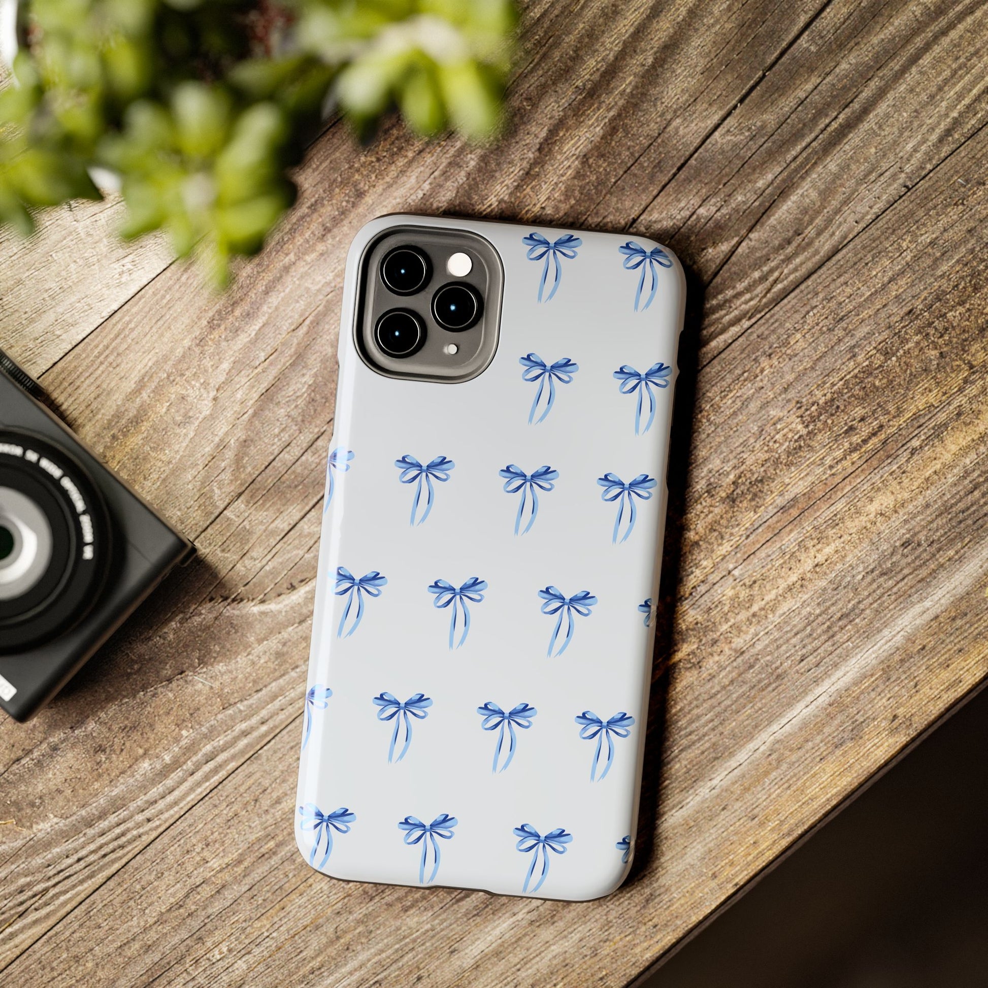 iPhone 11 Pro Max case with girly romantic watercolor blue bow pattern on a light blue background