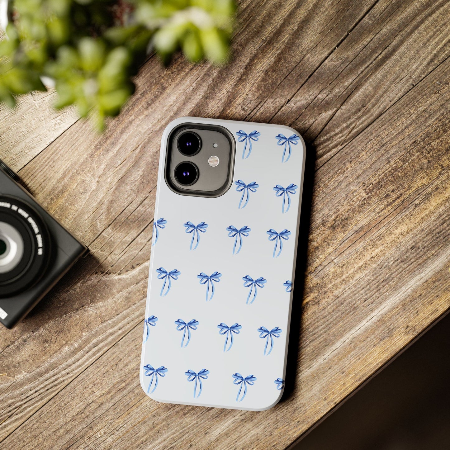 iPhone 12 case with girly romantic watercolor blue bow pattern on a light blue background