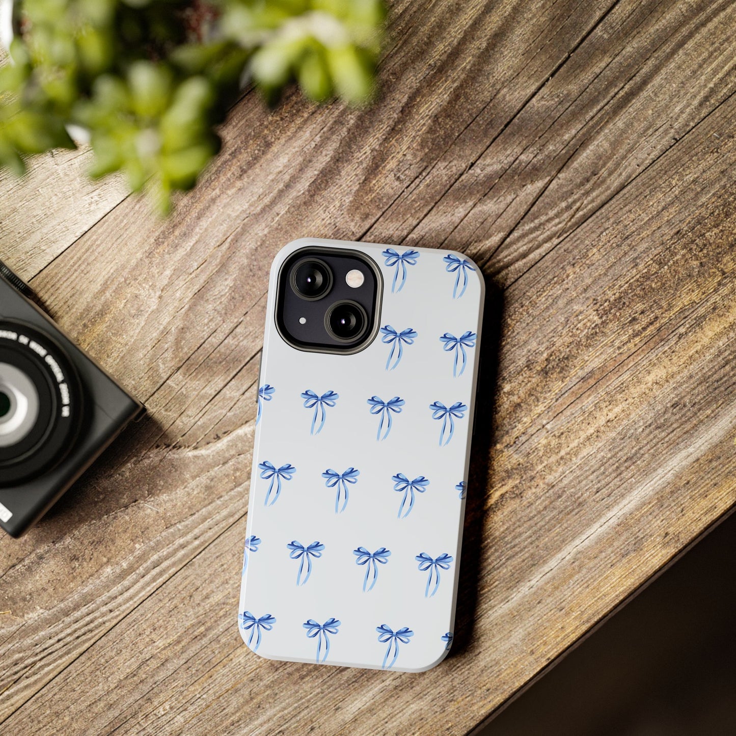 iPhone 13 Mini case with girly romantic watercolor blue bow pattern on a light blue background