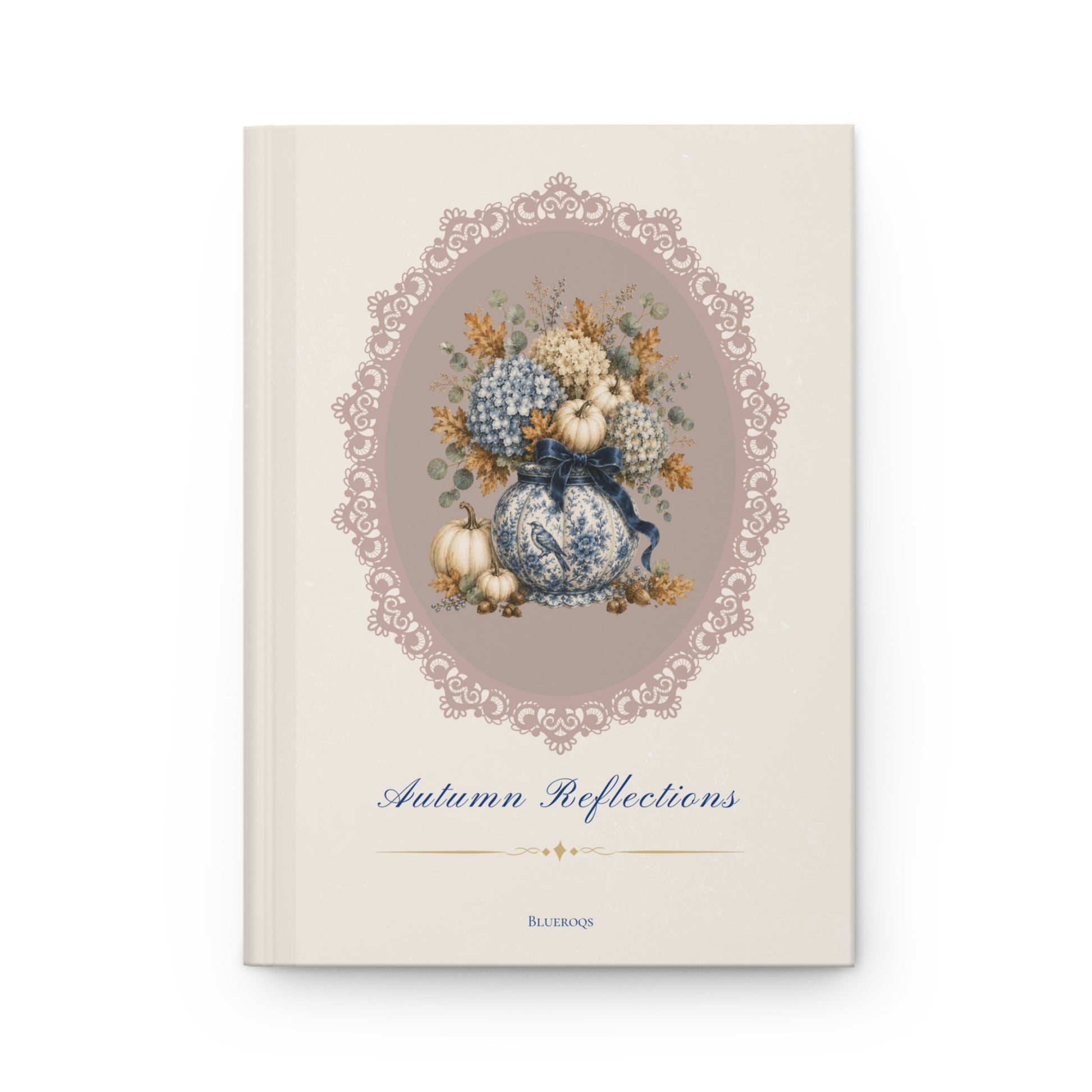 Autumn Reflections hardcover journal featuring a vintage floral arrangement of blue hydrangeas, porcelain-inspired vase, pumpkins and an elegant heirloom cameo frame on a cream cover.