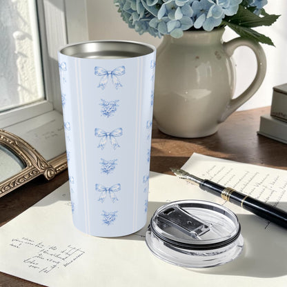20 oz blue bow and hydrangea tumbler styled with a journal and floral vase in a feminine stationery-inspired setting
