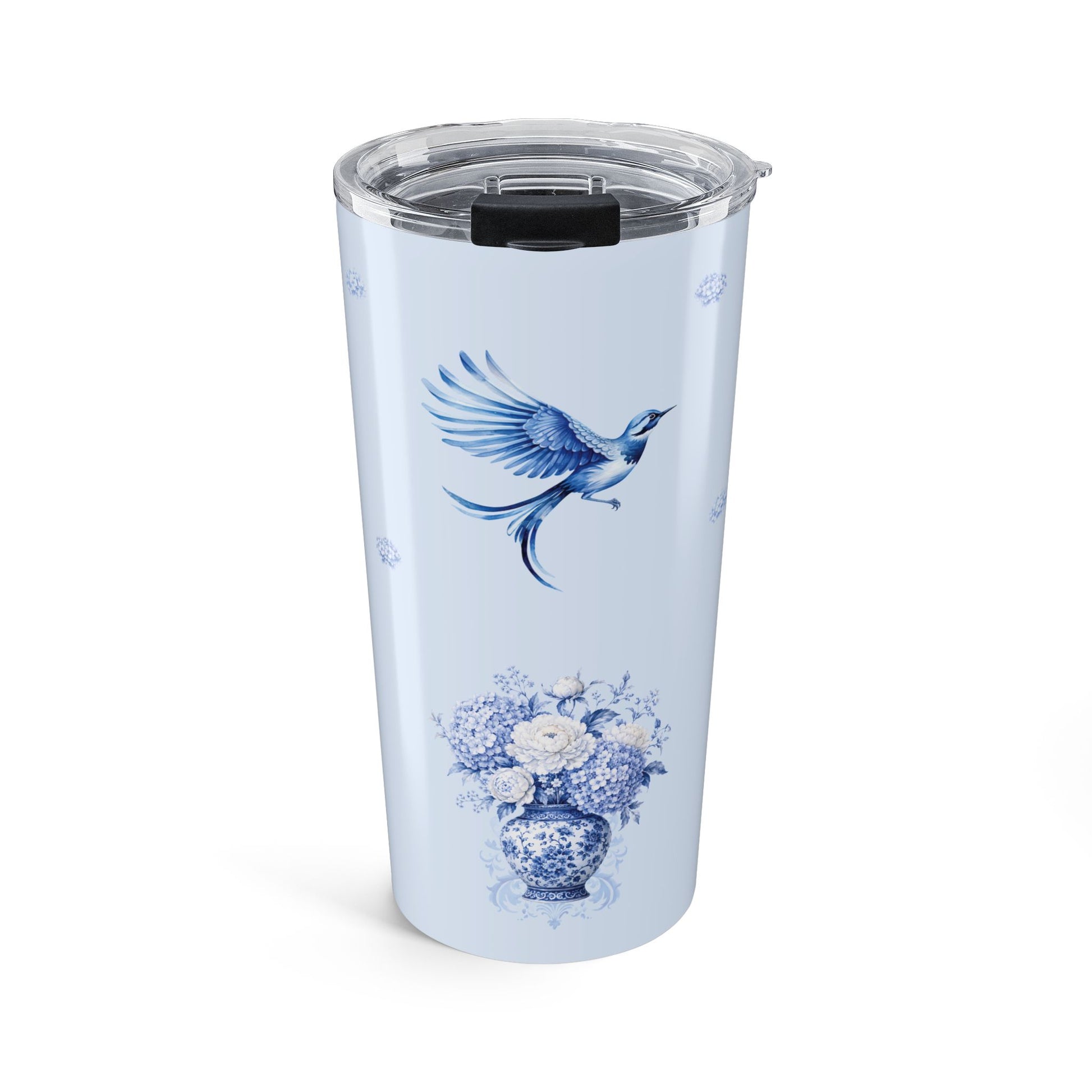 Blue chinoiserie bird tumbler featuring a flying bluebird and porcelain vase with hydrangea flowers