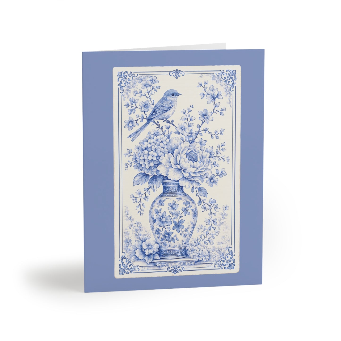 Blue chinoiserie floral greeting card featuring a vintage porcelain vase, blooming flowers, and a delicate bird illustration.