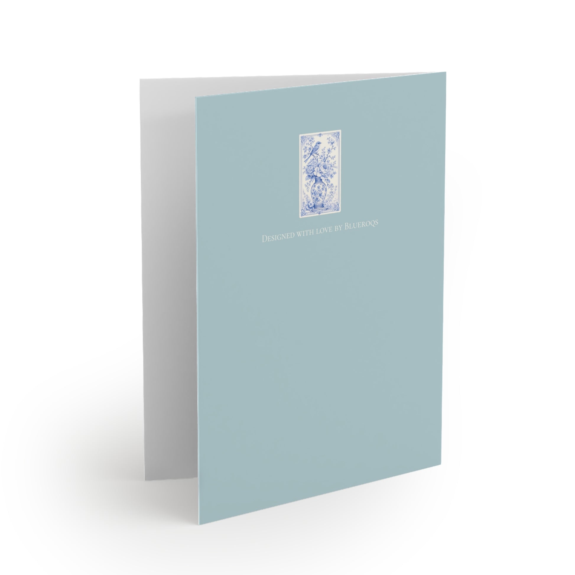 Back of blue chinoiserie greeting card with coordinating vintage floral artwork on a soft sea-glass blue background.