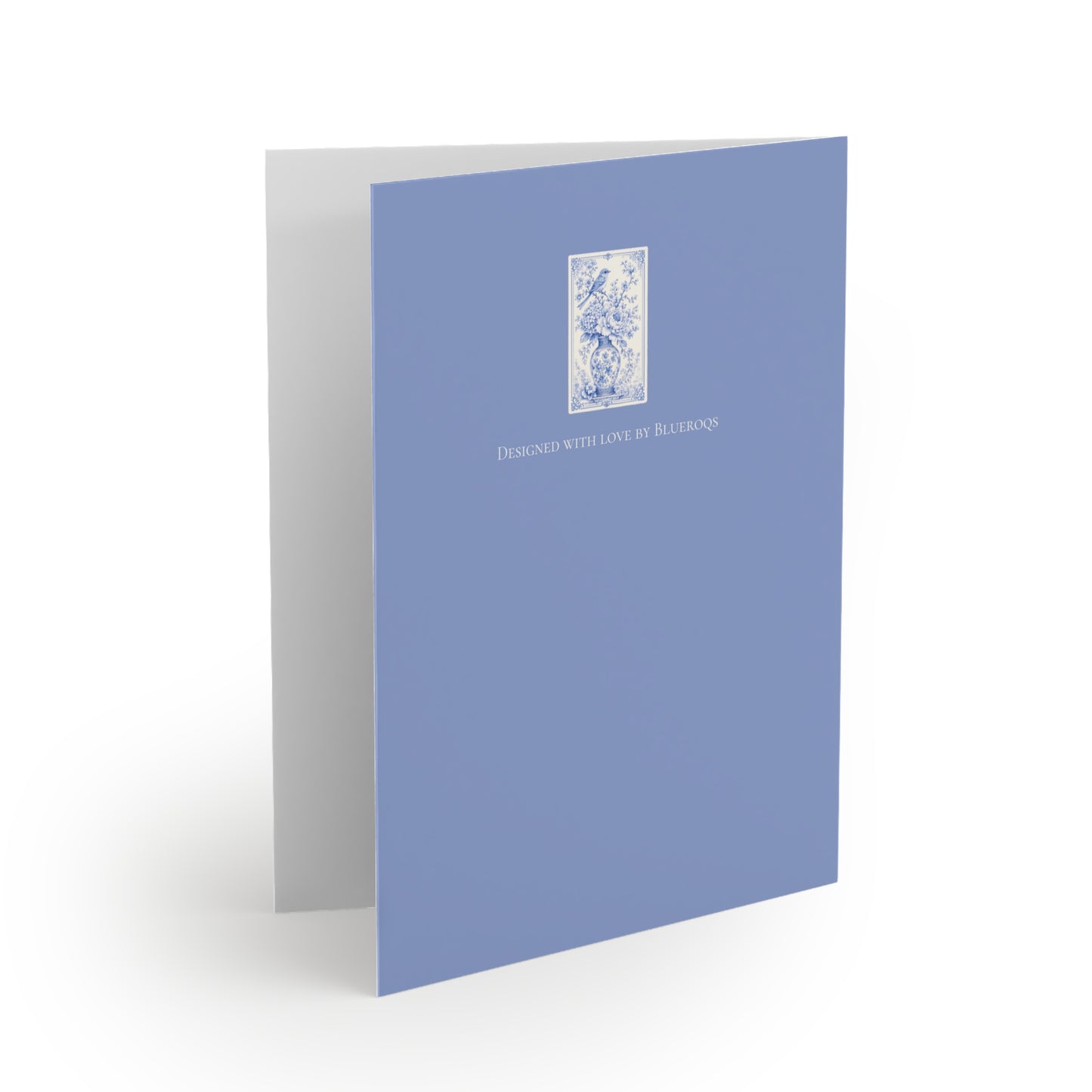 Back of a blue chinoiserie greeting card with coordinating powder blue design and floral artwork.