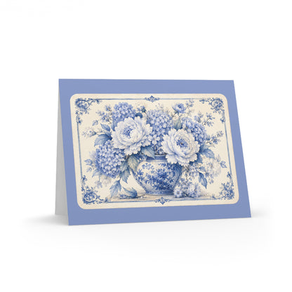 Blue chinoiserie floral greeting card featuring a vintage peony and hydrangea bouquet in a porcelain vase on a soft periwinkle blue folded card.