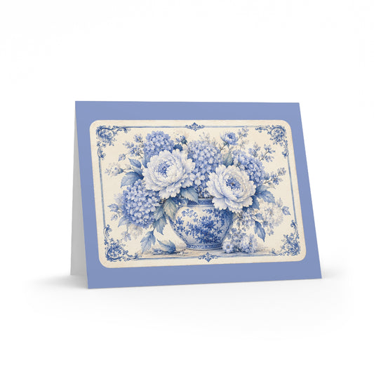 Blue chinoiserie floral greeting card featuring a vintage peony and hydrangea bouquet in a porcelain vase on a soft periwinkle blue folded card.