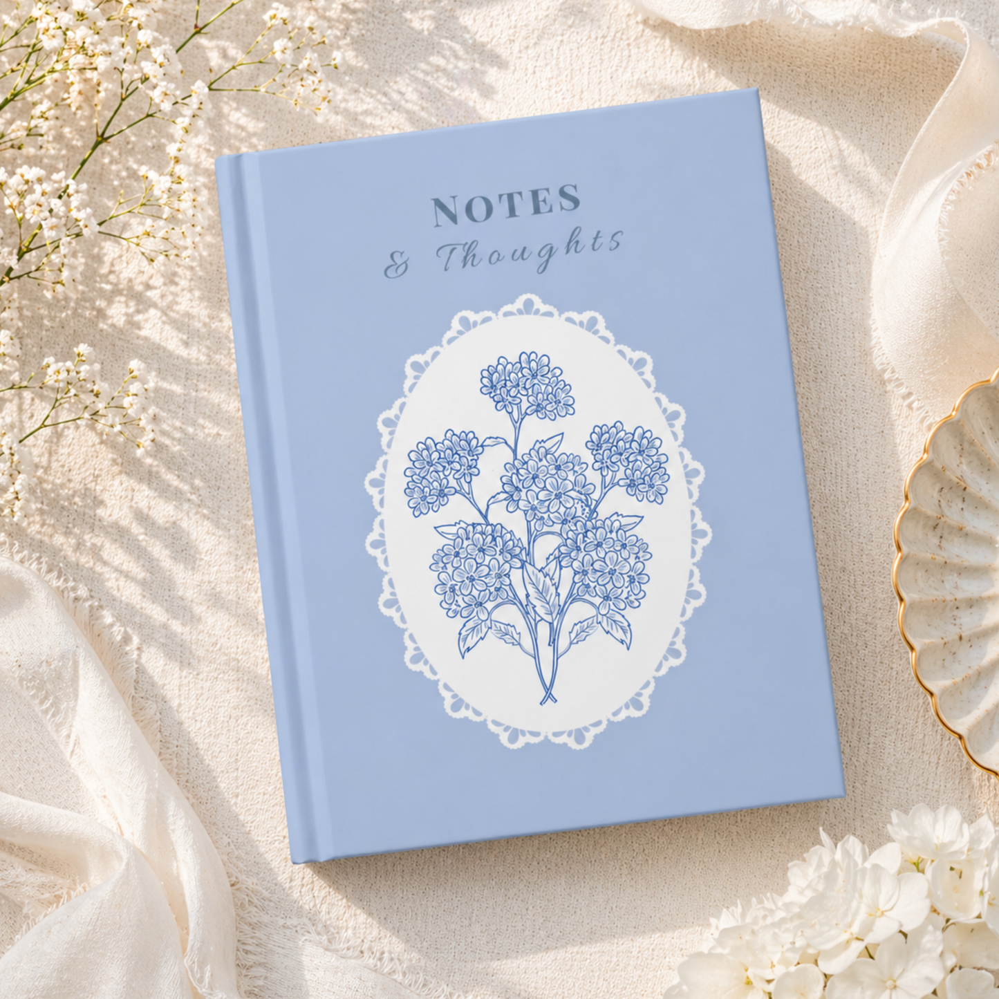 Blue vintage floral journal on soft fabric with flowers and coffee, aesthetic notebook for journaling and gift idea