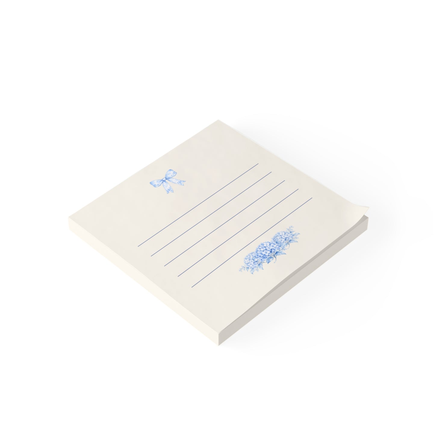 Blue bow floral sticky note pad shown in angled view with lined pages and hydrangea artwork