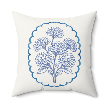 Blue hydrangea floral throw pillow with indigo botanical design on ivory fabric, square decorative cushion for living room or bedroom