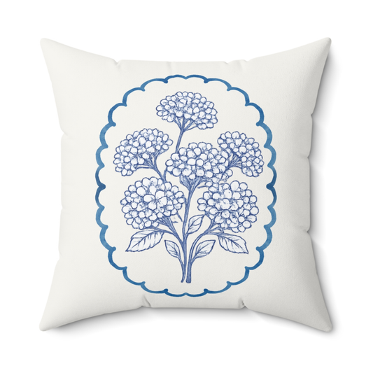 Blue hydrangea floral throw pillow with indigo botanical design on ivory fabric, square decorative cushion for living room or bedroom