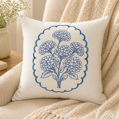 Blue hydrangea decorative pillow styled on neutral armchair in cozy cottagecore living room with soft natural light
