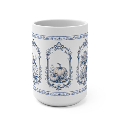 Blue transferware 15oz ceramic mug featuring vintage pumpkin, bird and botanical panels inspired by antique English pottery.