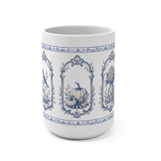 Blue transferware 15oz ceramic mug featuring vintage pumpkin, bird and botanical panels inspired by antique English pottery.