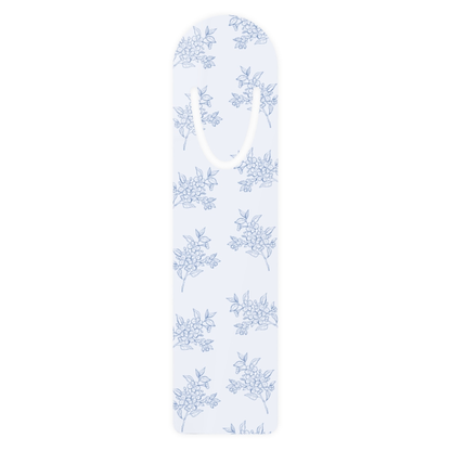 Blue floral metal bookmark with delicate botanical toile pattern on a white background