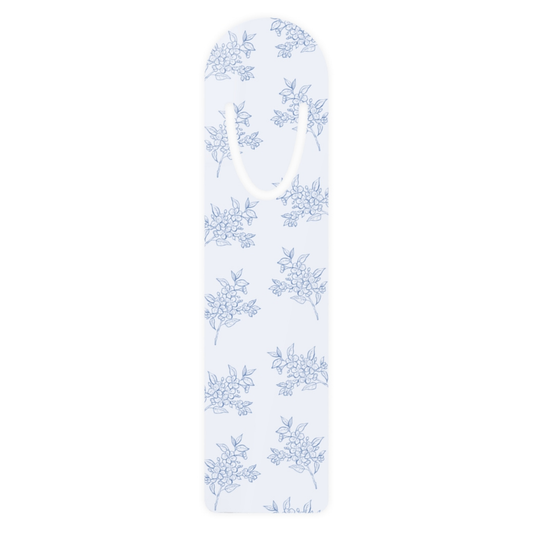 Blue floral metal bookmark with delicate botanical toile pattern on a white background