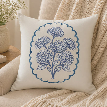 Video showing blue hydrangea floral throw pillow from multiple angles, highlighting texture, double-sided botanical design, and soft decorative cushion styling