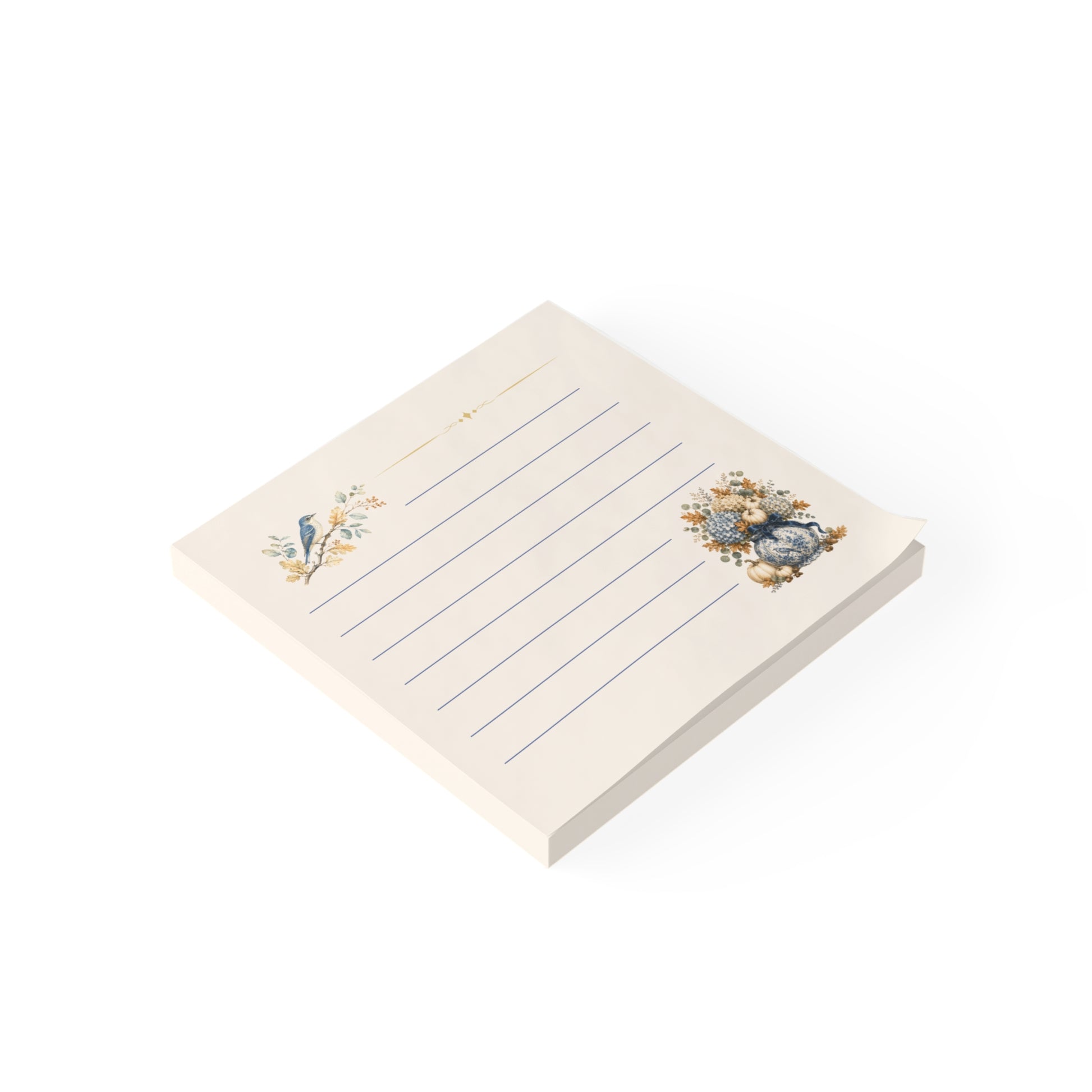 Angled view of a vintage bluebird sticky note pad featuring lined pages, botanical artwork, and an autumn floral bouquet.