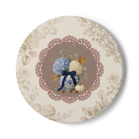 Vintage floral ceramic coaster featuring blue and ivory hydrangeas in a blue and white porcelain vase with a lace-inspired floral design.
