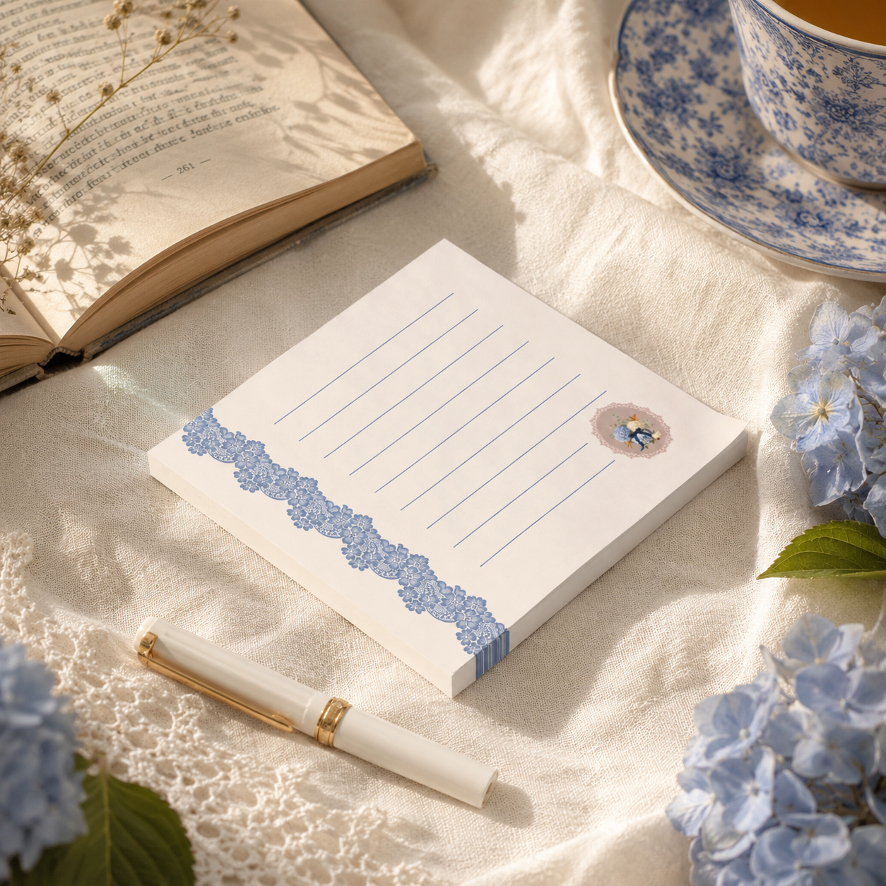Vintage floral sticky note pad styled on a cozy writing desk with books, blue-and-white porcelain, and soft morning light.