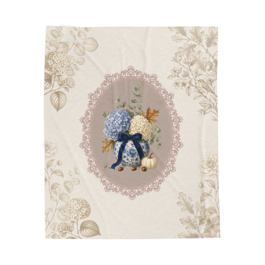 Vintage hydrangea velveteen plush blanket with blue and white porcelain vase, floral bouquet, lace frame and neutral botanical border.